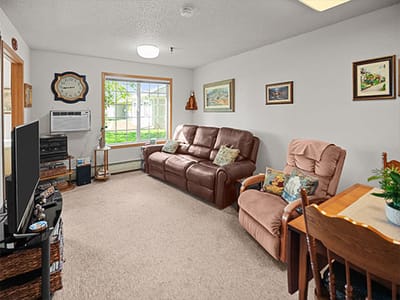 Cozy living room with comfortable seating and artwork