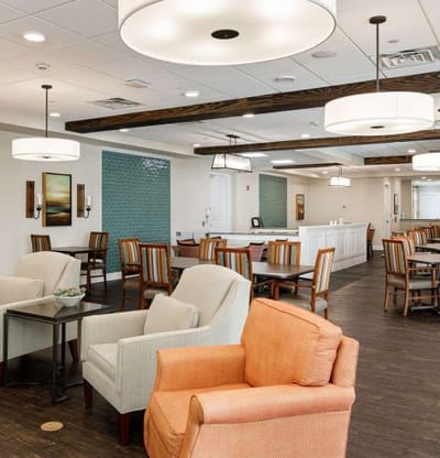 Bright and inviting common area with seating and tables
