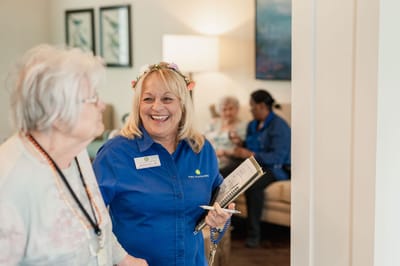 Staff member interacting with a resident in a common area