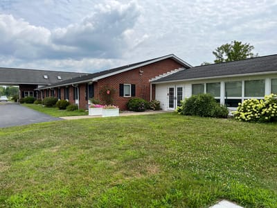 Exterior view of Emmanuel Home with landscaped gardens