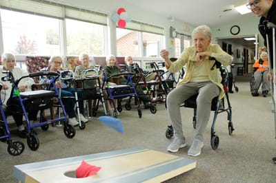 Residents participating in an indoor game activity