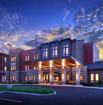 Exterior view of Friendship Village at sunset