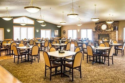 Bright and spacious dining room with tables and chairs