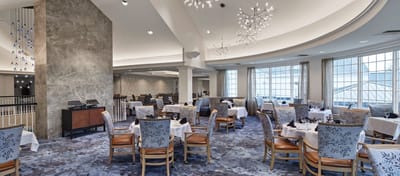 Dining area with elegant seating and decor