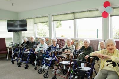 Residents seated in a cozy common area