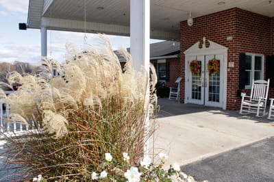 Exterior view of a facility entrance with decorations