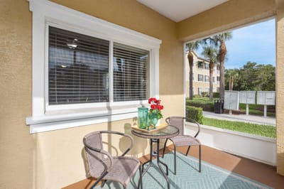 Outdoor seating area with flowers and a table
