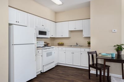 Bright kitchen area in a senior living unit