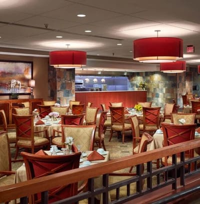 Interior view of a dining area with tables and chairs