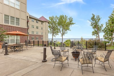 Outdoor patio with seating overlooking the lake