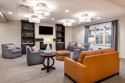 Cozy lounge area with modern furniture and bright lights
