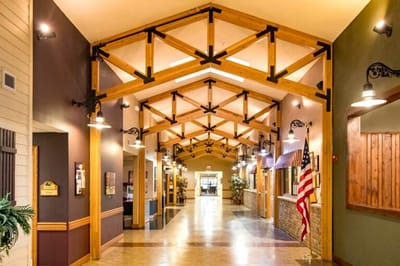 Interior hallway with wooden beams and American flag