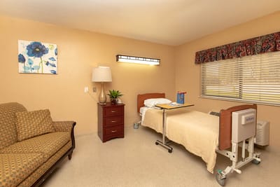Cozy resident room with bed and seating area