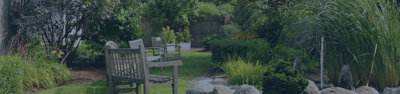 A serene garden with benches and flowers