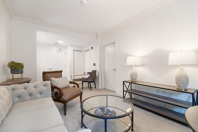 Cozy interior lounge area with seating and lamps