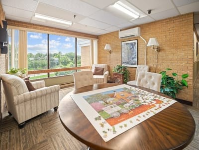 Bright common area with seating and a view