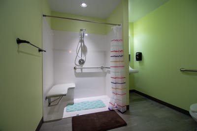 Accessible shower room with grab bars and safety features