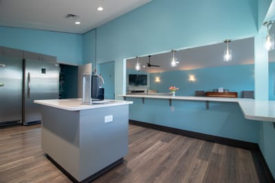 Bright, modern common area with kitchen amenities