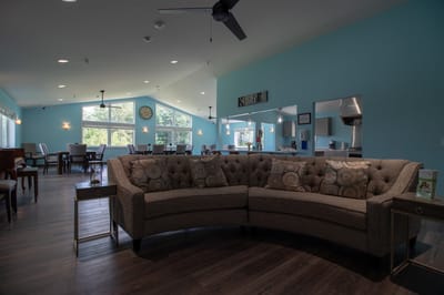 Interior view of a dining room area with a cozy couch