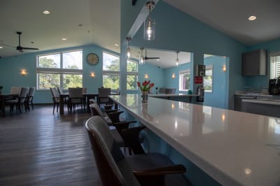Bright common area with seating and large windows
