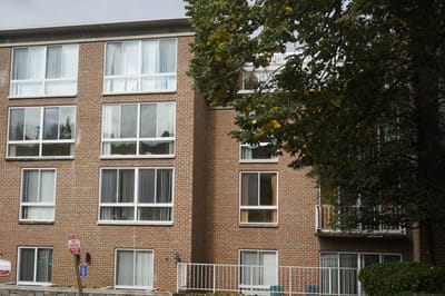 Exterior view of a residential building with large windows