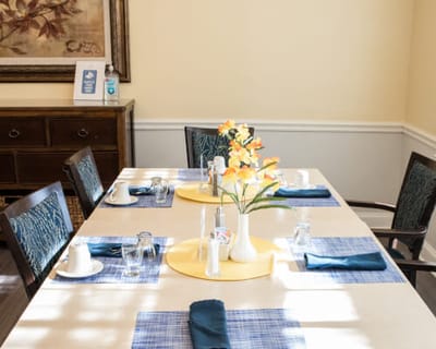 Bright dining room table set for a meal