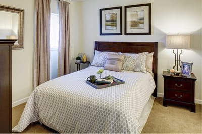 Cozy private bedroom with a neatly made bed
