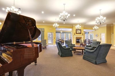 Common area with piano and comfortable seating