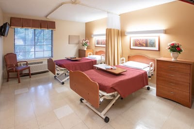 Interior view of a shared resident room with beds