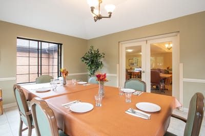 Dining table set up for a meal in a common area