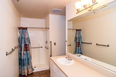 Bright and clean bathroom with shower and sink