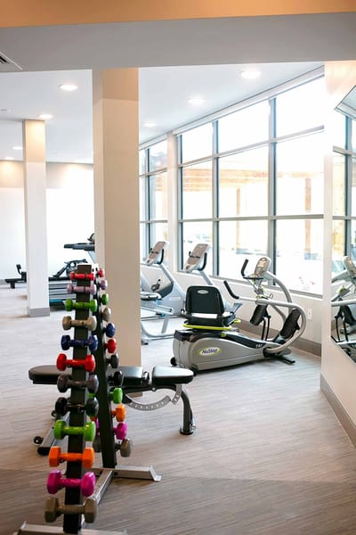 Interior view of a modern fitness room with exercise equipment
