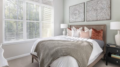 Brightly decorated private resident room with large windows