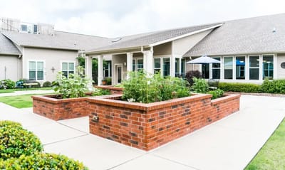 Beautiful outdoor garden area with brick landscaping
