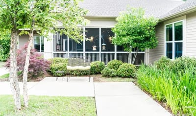 Outdoor pathway with seating and landscaping