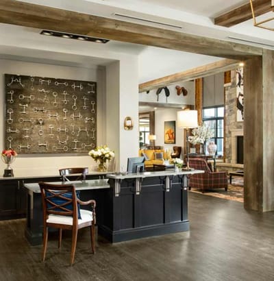 A comfortable lobby with seating and natural decor