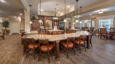 Bright and spacious common area with kitchen and seating