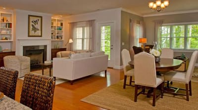 Bright and inviting common area with seating and dining space