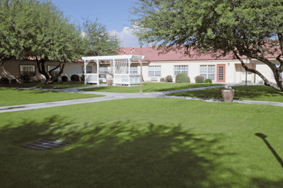 A well-maintained outdoor space with a gazebo and lush lawn