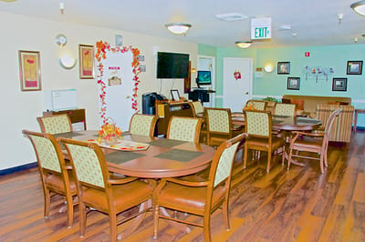 Cozy common area with dining tables and decor