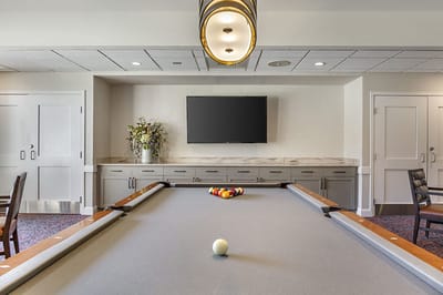 Interior view of a billiards table in a recreational room
