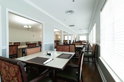 Interior view of a dining area with tables and chairs