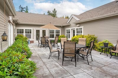 Outdoor patio area with tables and chairs
