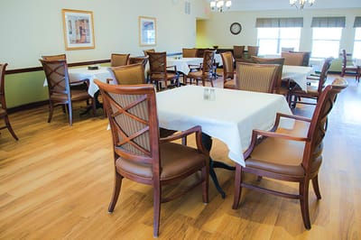 Dining area with wooden tables and chairs