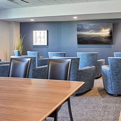 Common area with comfortable seating and wall art
