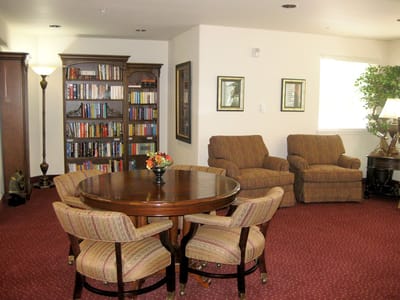 Cozy common area with seating and bookshelves