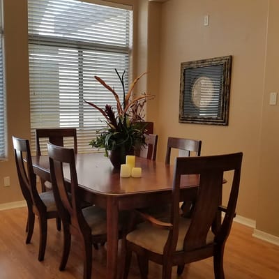 Dining area with wooden table and chairs