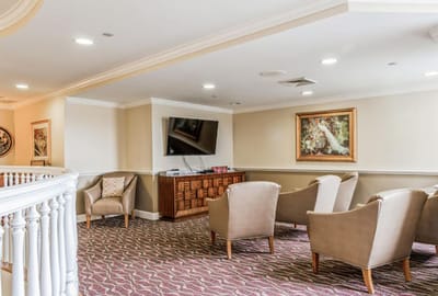 Common area with seating and TV