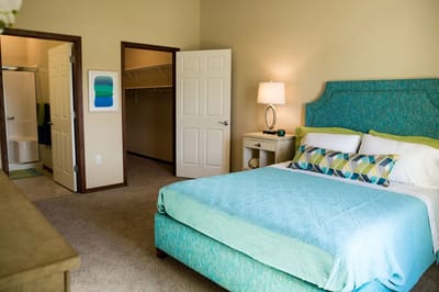 Well-furnished private resident room with a cozy bed