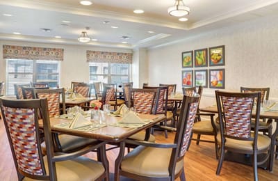 Bright dining area with tables set for meals